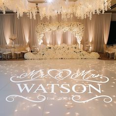 a white dance floor with the words mr and mrs written on it