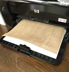 an open printer sitting on top of a wooden table