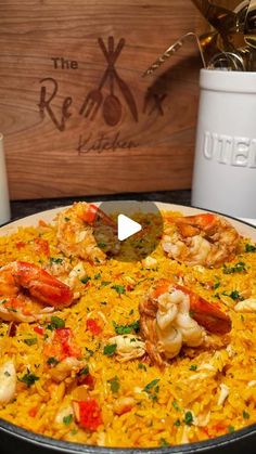 the paella is ready to be served in the pot with shrimp and other foods