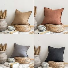 four different pillows sitting on top of a table next to a vase with some plants in it