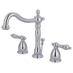 a chrome faucet with two handles