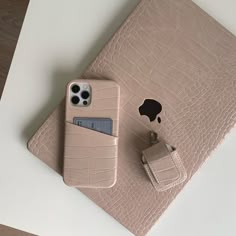 an iphone case with a card holder attached to it and a wallet on the side