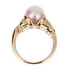 The Vintage Bvlgari Pearl Diamond Yellow Gold Ring is an exquisite piece of jewelry that exemplifies the luxurious craftsmanship and timeless elegance for which the Bvlgari brand is renowned. This stunning ring features a magnificent 9mm pearl as its centerpiece, radiating a soft and enchanting luster that captivates the eye. The pearl is flawlessly round, with a smooth and reflective surface that displays subtle hues of white and cream, adding to its mesmerizing beauty. Crafted from 18k yellow Vintage Bvlgari, Bvlgari Ring, Yellow Gold Cocktail Ring, Bvlgari Jewelry, Mesmerizing Beauty, Elegant Aesthetic, Gold Cocktail Ring, Gold Cocktail, Vintage Pearl