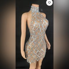 a mannequin wearing a dress with sequins on it