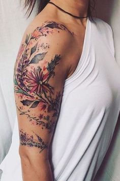 a woman with a flower tattoo on her arm