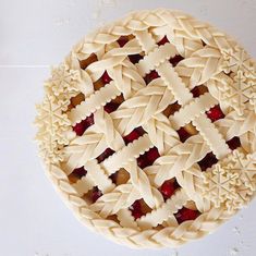 a pie with many pieces cut out on it's sides and sitting on a white surface