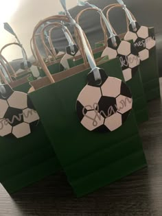 some paper bags with soccer balls on them