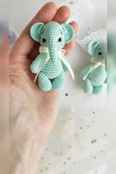 there is a small stuffed elephant in the hand