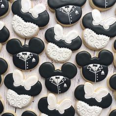 mickey and minnie mouse cookies are arranged on a table