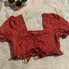 This Is An Adorable Crop That Has A Vintage Design Runched Back And Even Ability To Adjust How Low Front Will Come In Chest Area! New Never Worn And In Excellent Condition. Unfortunately Too Big For Me. Maroon And White Floral Design! Perfect For Spring And Summer Cute Red V-neck Top, Cute Red Tops For Vacation, Cute Red Crop Top For Spring, Trendy Red Crop Top With Floral Print, Trendy Red Floral Print Crop Top, Cute Red Floral Print Tops, Tops Shein, White Floral Design, Shein Tops