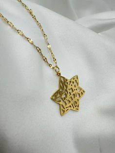 This Shema Israel Star of David 18K Gold-Plated Pendant Necklace is a unisex treasure that bridges faith and fashion with grace and strength. Crafted to resonate with the profound Shema Israel prayer, the pendant carries the initials שמ"ע ישראל ה' אלוהינו ה' אחד, embodying the central tenet of Jewish faith — the oneness of God. Its timeless design and spiritual significance make it a versatile piece suitable for all genders and ages. Features: Materials: 18K Gold-Plated Brass Pendant Diameter: 1 Star Of David, Brass Pendant, Gold Pendant Necklace, Earring Necklace, Gold Pendant, Timeless Design, Initials, 18k Gold, Gold Plate