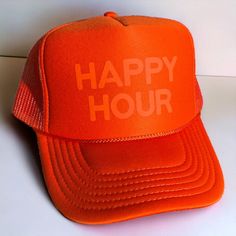 Be bold and make a statement with your style wearing the Happy Hour Trucker Hat. This fun foam trucker hat features a stylish monochrome design and breathable mesh back. An ideal accessory to express your personality and make a statement. Get ready for happy hour! Summer Party Trucker Hat, Trendy Orange Trucker Hat For Summer, Fun Orange Trucker Hat, Fun Orange Trucker Hat One Size Fits Most, Trendy Orange Trucker Hat One Size, Trendy Orange Trucker Hat, Trendy Orange Trucker Hat One Size Fits Most, Trendy Orange Snapback Trucker Hat, Ootd Casual Chic