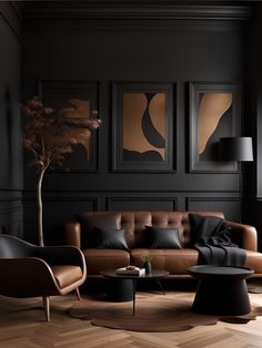 a living room with black walls and leather furniture