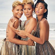 two women hugging each other on the beach