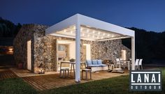 an outdoor living area lit up at night