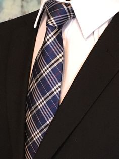 "For the man who loves plaid, Ed's Neckties offers this 100% silk mens plain necktie. Features a navy blue background with blue, gray and red plaid pattern. Available as a extra long tie. Handmade from 100% silk, this special collection features a .75\" Eds Neckties logo at the bottom right front corner of every tie and a larger logo located on the tipping (Back of the tie). The label features the collection name (Nathaniel Alexandria) Named after my son Nathaniel and my daughter Alexandria. Exp Make A Tie, Get A Girlfriend, Tie Men's, Plaid Tie, Navy Blue Background, Current Styles, Mens Plaid, Men's Wear, Men's Suits