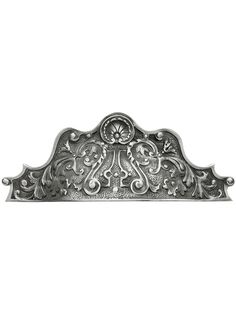 an ornate metal plaque on a white background