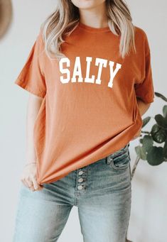 Salty T-shirt Trendy Comfort Colors Comfort Colors T-shirt Trendy T-shirts Summer Shirts Gift for Her Spring Beachy - Etsy Orange Short Sleeve T-shirt With Letter Print, Orange Short Sleeve T-shirt With Text Print, Casual Short Sleeve Tops With Funny Text, Casual Orange T-shirt For Everyday, Summer Orange Tops With Slogan, Orange Relaxed Fit T-shirt With Letter Print, Orange Letter Print T-shirt For Spring, Tan T-shirt With Letter Print For Spring, Orange Summer T-shirt For Everyday