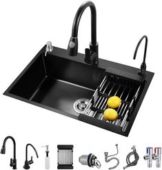 a kitchen sink with two faucets and various accessories