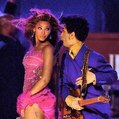 the singer and his girlfriend perform on stage at awards