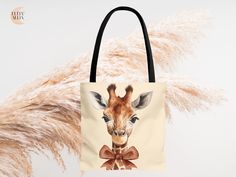 Our adorable Giraffe Brown Bow Tote Bag, the perfect Mom carryall for everyday use! This stylish tote features a charming double sided print of giraffes and bows, adding a touch of whimsy to your outfit. With its spacious interior and sturdy construction, this tote is ideal for carrying all your essentials while on the go. Whether you're heading to the grocery store or running errands, this Giraffe Brown Bow Tote Bag is sure to be your new favorite accessory. -High quality tote bag -All-over pri Animal Design Pouch Bags As Gifts, Animal Design Pouch Bag For Gift, Animal Design Pouch Bag As Gift, Animal Design Tote Bag For Gift, Animal Design Tote Bag As Gift, Bow Tote Bag, Mom Accessories, Nursery Gift, Giraffes