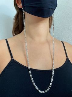 A silver mask chain. The purpose of this accessory is to always have the mask at hand without having to rest it somewhere. This helps prevent the mask from coming into contact with other surfaces, reducing the risk of contagion. It has small silver clips in both sides to hold the cords of the mask. It measures approximately 60 cm long. Since it is silver or golden, you can combine it with most masks or outfits. If you are interested in other handmade accessories like this, please visit our store Silver Mask, Mask Holder, Mask Chain, Chain Silver, Handmade Accessories, Clip Ins, Silver Chain, Beauty And Personal Care, Face Mask