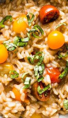 a bowl filled with rice and tomatoes