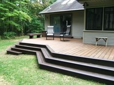 a wooden deck with steps leading up to it