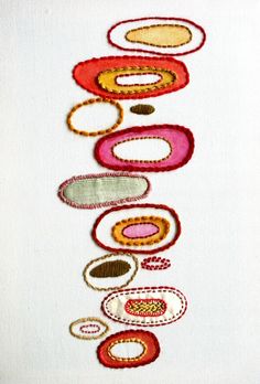 an embroidery pattern with circles on it