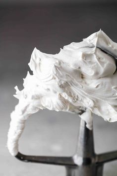 whipped cream on top of a metal stand