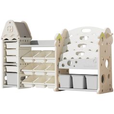 a wooden doll house with white furniture and shelves for dolls, including an open book shelf