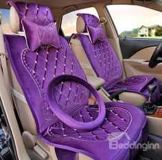 two purple seats in the back of a car with steering wheel and footrests