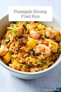 pineapple shrimp fried rice in a white bowl with text overlay that reads pineapple shrimp fried rice