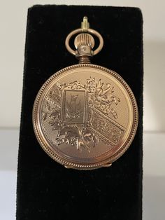 1885 antique solid 14 kt gold hunt case Elgin pocket watch. This watch is a size 8 with fancy engravings on the front and back there is a large letter N engraved on the front cover. This stunning watch is in good working condition and features a lever set style for setting the time where you must pull the lever out on the dial for the hand to move freely then push it back in place after setting the time. The porcelain dial features a sunken seconds at the 6 o'clock, the dial is pristine without cracks or hairlines simply says Elgin. The case features a textures center section easy to grip for opening and closing the case. Victorian Yellow Gold Pocket Watch For Anniversary, Vintage Engraved Bronze Pocket Watch, Antique Yellow Gold Pocket Watch Collectible, Victorian Yellow Gold Pocket Watch Collectible, Victorian Yellow Gold Pocket Watch For Collectors, Antique Bronze Engraved Pocket Watch, Antique Gold Pocket Watch With Locket For Formal Occasions, Formal Antique Gold Pocket Watch With Locket, Victorian Gold Watch For Formal Occasions