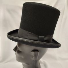 Broadway Quality, Made In Usa, 100% Wool Squire 6.25" Top Hat. Color: Black American / Nearest 1/8 Inch / Metric Cm / Size Code 6 3/4 21 1/8 54 Small 6 7/8 21 1/2 55 Small / Child L Broadway Quality Made In Usa By Hxc Hatcrafters Inc. These Hats Are Of High Quality And No Longer Manufactured So The Sizes And Quantity Available Are Finite. We Also Cannot Accept Lower Bids On These Hats As They Are Already At Reduced Prices. Black Formal Costume Hat With Curved Brim, Formal Black Costume Hats With Curved Brim, Black Mini Hat With Curved Brim, Black High Crown Hat For Formal Occasions, Fitted Wide Brim Hat For Derby, Black Hat Bands For Kentucky Derby With Curved Brim, Classic Adjustable Mini Hat With Short Brim, Elegant Black Felt Hat With Flat Bill, Adjustable Black Top Hat For Winter