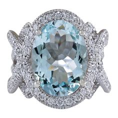 Introducing our breathtaking 14K White Gold Diamond Ring, a true embodiment of elegance and sophistication. Weighing 14.4 grams and meticulously stamped with 14K White Gold, this remarkable ring features a magnificent 8.91 Carat Aquamarine centerpiece, measuring 16.00x12.00 mm. Encircling the Aquamarine are dazzling diamonds weighing 2.10 Carats, boasting a stunning F-G color and VS2-SI1 clarity. With a face measuring 21.30x17.50 mm, this ring is a timeless masterpiece that exudes opulence and g Aquamarine Cocktail Ring, 14k White Gold Diamond Ring, Gold Cocktail Ring, Gold Cocktail, Aquamarine Jewelry, Diamond Cocktail Rings, Gold Diamond Ring, White Gold Diamond Rings, Natural Aquamarine