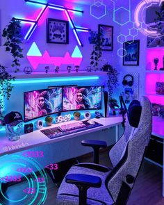 a computer desk with two monitors on it and neon lights in the room behind it