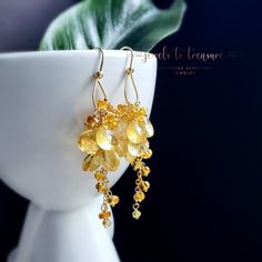 "Golden Citrine Gemstone Earrings on Gold Filled Ear Wires Golden citrine heart briolettes gently faceted and with pristine clarity cascade from a hand formed gold filled hoop 1pc ear wire.  A waterfall of citrines.   Total length 2.25\" long  Materials:  ⚜Gemstones: -8mm faceted citrine heart briolettes  ⚜Metals: All metals are Gold filled  Gold Filled Ear Wires  ⚜Total Length 2.5\" long  🎁Your earrings come beautifully wrapped, adorned and ready for gift giving.  🌏I offer International Shipp Elegant Briolette Citrine Jewelry, Elegant Citrine Earrings, Gold Citrine Earrings With Gemstone Accents, Yellow Gold Citrine Gemstone Earrings, Yellow Gold Citrine Dangle Earrings, Gold Filled Hoops, Citrine Gemstone, Fort Myers, Ear Wire