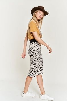 Unleash your wild side with our Clara Animal Print Skirt. Made from cozy sweater material, these skirts not only make a statement with their fun animal print, but also keep you warm and comfortable. Perfect for a playful and stylish look on any occasion. Model is 5'9" wearing a small Trendy Skirt With Elastic Waistband, Leopard Print Skirt For A Day Out, Casual Leopard Print Skirt For Fall, Casual Leopard Print Midi Skirt Bottoms, Casual Leopard Print Midi Skirt, Casual Leopard Print Skirt For Spring, Casual Leopard Print Skirt For Day Out, Leopard Print Lined Bottoms With Relaxed Fit, Casual Leopard Print Pencil Skirt