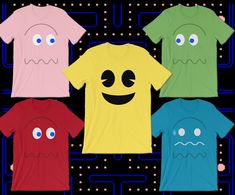 four t - shirts with different colored faces on them, all in front of a circuit board