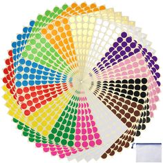 a rainbow colored fan with dots on it