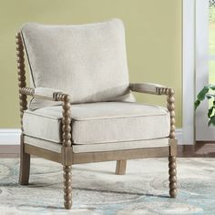 a living room with a chair and rug