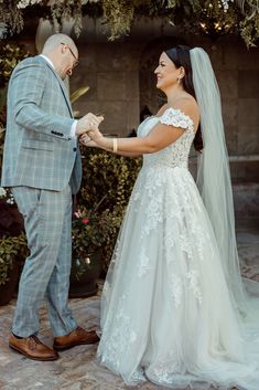 the bride and groom are exchanging their wedding vows