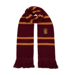 a harry potter scarf with fringes on the bottom and an emblem on the front