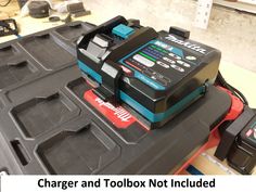 a battery and toolbox not included on a work bench