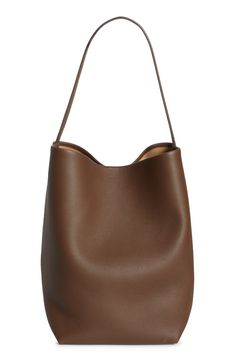 A softly structured silhouette defines this timeless tote crafted from supple calfskin leather. Open top Shoulder strap Leather lining Leather Made in Italy Designer Handbags North South, Dark Taupe, Leather Tote, Calf Skin, The Row, Leather Straps, Shoulder Strap, Nordstrom, Handbags