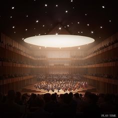 an auditorium filled with lots of people on stage and in front of a large circular ceiling