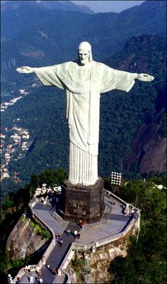 the statue of christ is on top of a mountain