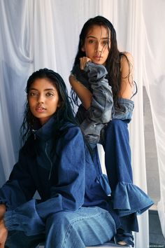 two young women sitting next to each other