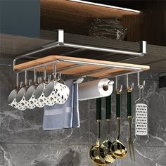 a rack with pots and pans hanging from it